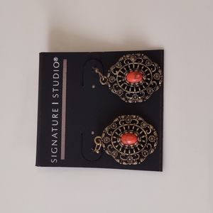 Dangling earrings by Signature Studio